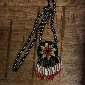 Handmade Black Beaded Pendant Necklace with Yellow & Orange Starburst